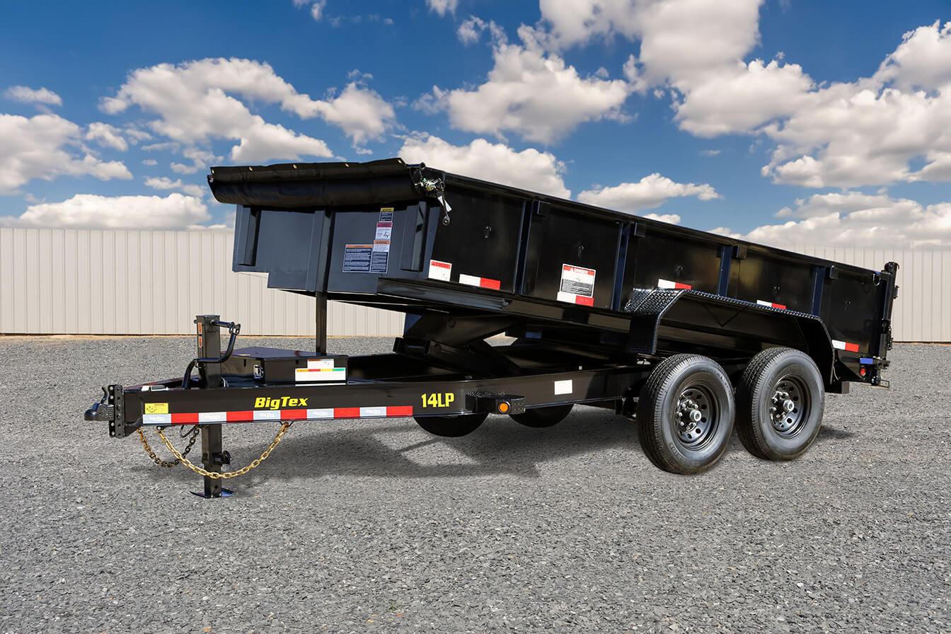 2024 Big Tex Heavy Duty Ultra Low Profile Dump Trailer 83”x 12’ w/ combo gate, spare tire mount, 6’ slide in ramps, tarp kit.   Black image 1