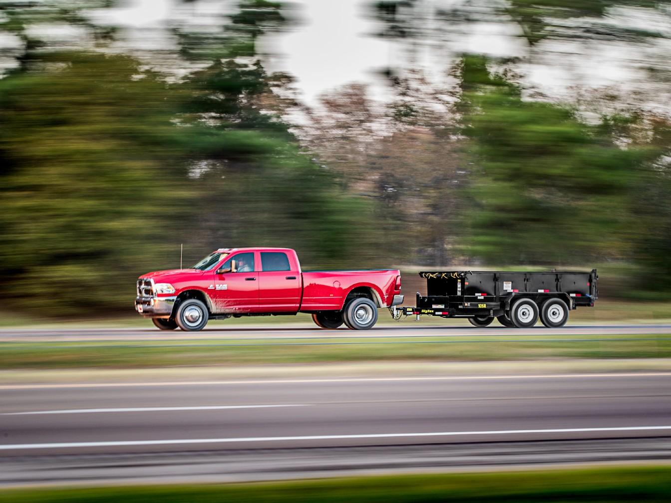 2022 Big Tex Pro Series Tandem Axle Single Ram Dump Trailer 83”x 12’ w/ combo gate, spare tire mount, 6’ slide in ramps. image 6