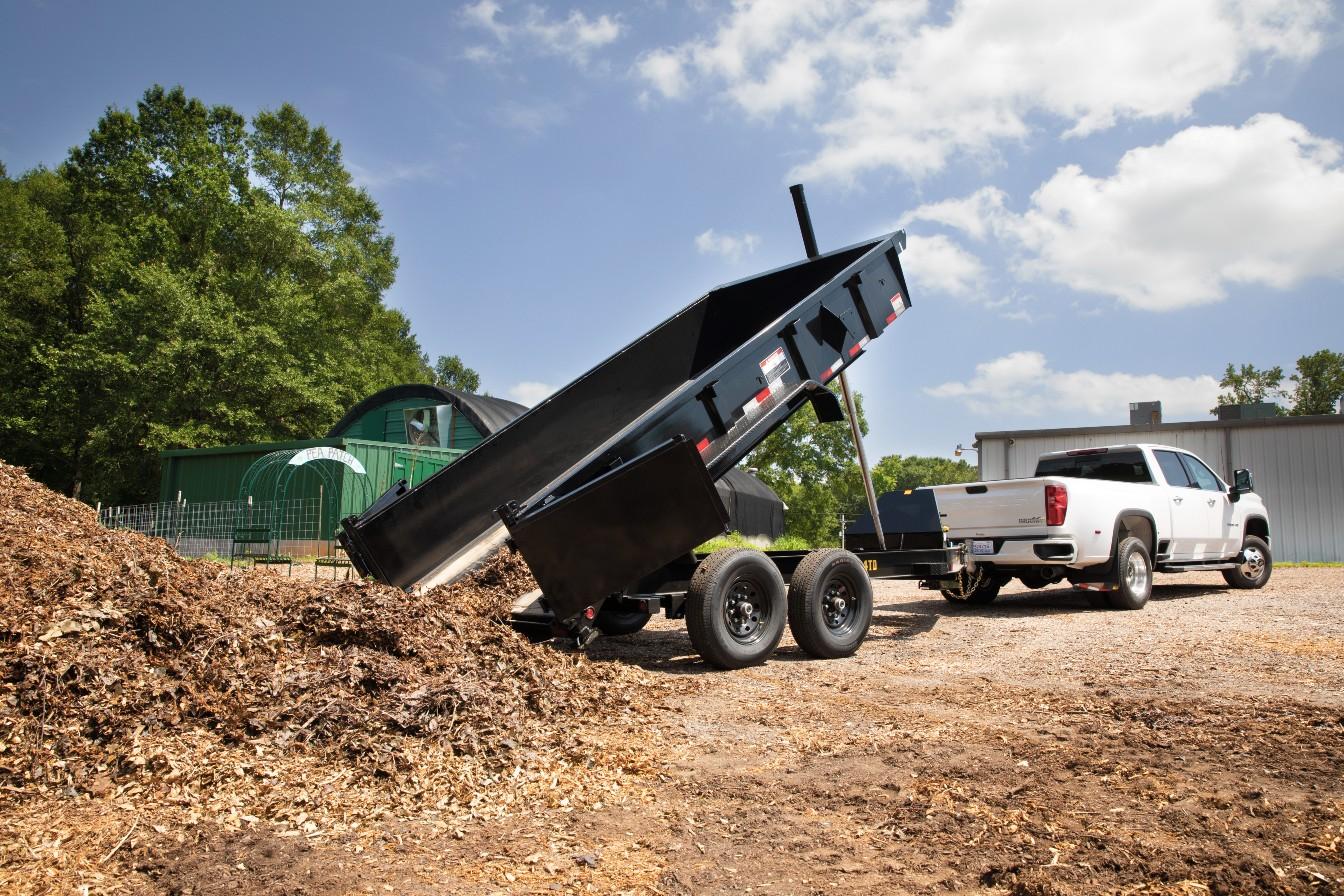 2024 Big Tex Heavy Duty Telescopic Dump Trailer 83”x 14’ w/ combo gate, spare tire mount, 6’ slide in ramps, tarp kit.  Black image 2